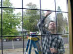 Dave reglazing the leaded panes (357209 bytes)