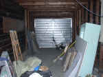 Attached garage interior with original tub to be reset (338578 bytes)
